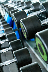Close up image of Fitness equipment dumbbells weight,Gym background  
