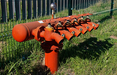 Red Fire hydrants with many outlet pipes