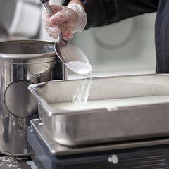 Making Of Ice-Cream - Pouring stevia powder into the pan
