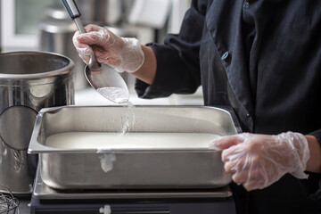 Making Of Ice-Cream - Pouring stevia powder into the pan