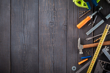 Work tool of the wizard. Tape measure, screwdriver, hammer, wrenches, clamp, screws, drills and...