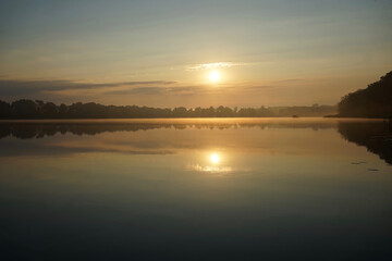 Morning fog at lake Paelitzsee, Mecklenburg lake district.    