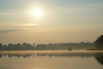Obraz na płótnie Canvas Morning fog at lake Paelitzsee, Mecklenburg lake district. 