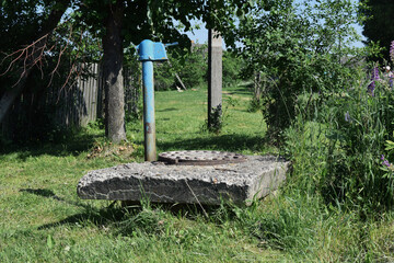 rustic blue water hydrant in the village