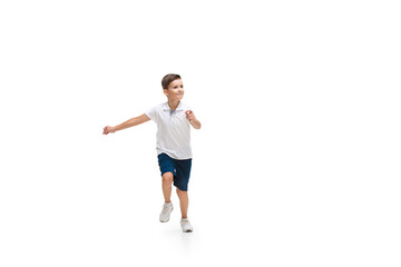 Happy kids, little and emotional caucasian boy jumping and running isolated on white background. Look happy, cheerful, sincere. Copyspace for ad. Childhood, education, happiness concept.