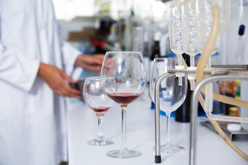 modern laboratory of winery. Checking acidity of wine and organoleptic characteristics