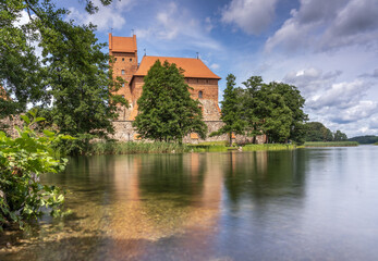 Fototapeta na wymiar Trakai Island Castle, Trakai, Lithuania, on an island in Lake Galve. Built in the 14th c. it was was one of the main centers of the Grand Duchy of Lithuania