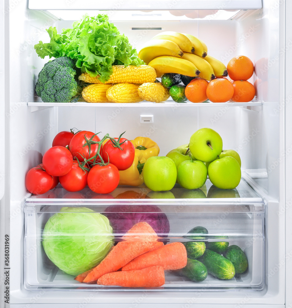 Wall mural open fridge full of vegetables and fruits