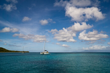 Caribbean, French West Indies, Guadeloupe island, sailing along the coast, view of a bay with its beach and crystal clear water