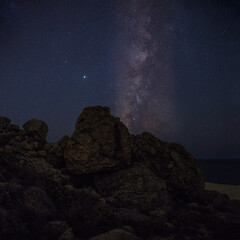 Fototapeta na wymiar The Milky Way in the background on the Maltese Coast