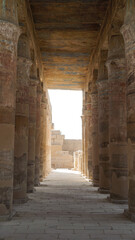 Luxor Egypt Columns in Karnak temple with remaining clue color paint on ceiling