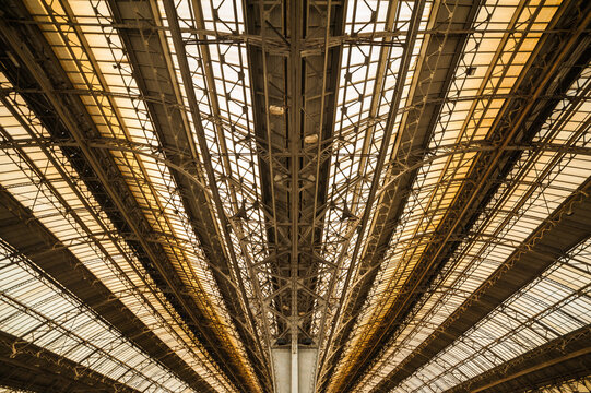 Old European train station with a platform. Arch metal train station.