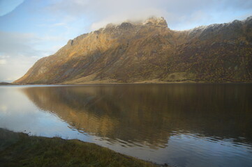 Fototapeta na wymiar Autumn colors and reflections in the Norwegian mountains of the Lofoten Fjords in Norway