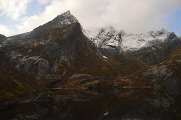 Colorful autumn refelctions and colors in the mountains on the beautiful fjords of Lofoten in Norway