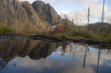 Colorful autumn refelctions and colors in the mountains on the beautiful fjords of Lofoten in Norway
