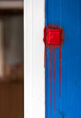 Lightswitch with dripping red paint