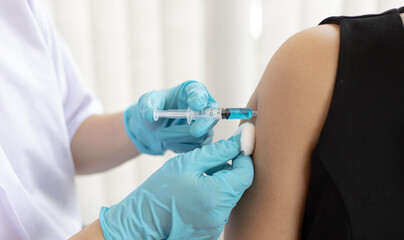 Doctor vaccinated against new strains of the virus for the patient to build immunity.