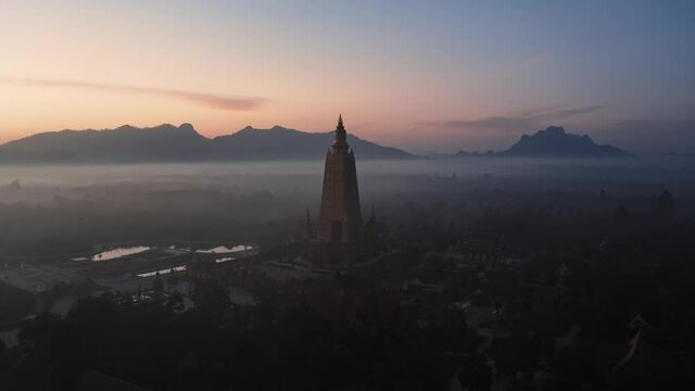 Drone aerial shot of sunrise over Wat Mahathat Watchiramongkhon (Wat Bang Thong) in Krabi, Thailand