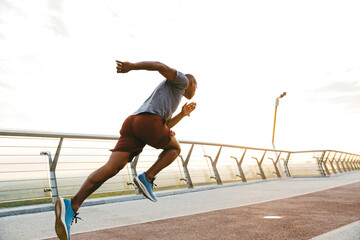 Young african man jogger exercising outdoors