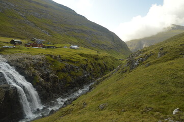 Fototapeta premium The dramatic and mystical landscape by the coast and in the mountains of the Faroe Islands