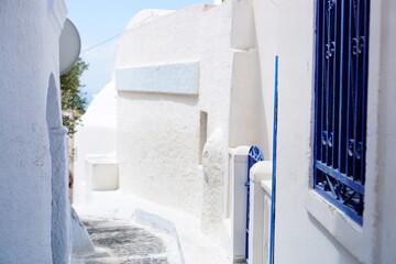 The beautiful narrow alley of Santorini island at daytime in Greece, Europe