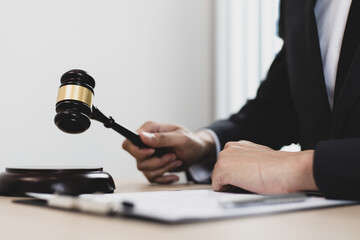 Lawyer in a black suit is currently investigating in the courtroom.