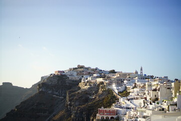 The sunset shines the sea, beautiful city, Thira, Greece, Europe