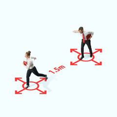 Studio shot of people demonstrating social distancing with arrows indicating the separation. Office workers during coronavirus outbreak with new rules for safety and healthcare. High angle view