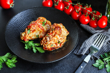 chicken in tomato sauce piece of vegetables chunk fried chakhokhbili or chashushuli second course food background top view copy space for text organic eating healthy
