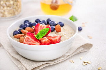 Healthy homemade oatmeal with berries for breakfast