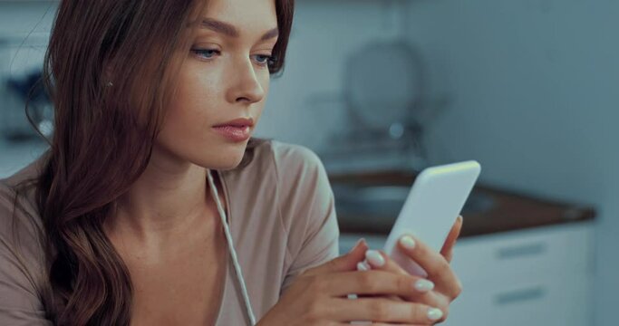 selective focus of young woman using smartphone
