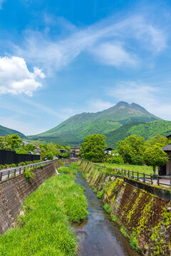 rural canal of  Yufu and Mount Yufudake in Yufuin city, yufuin is countryside and tourist destination town in Oita, Japan.