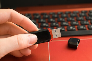 Usb flash drive in hand close up