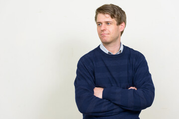 Portrait of young handsome man with blond hair