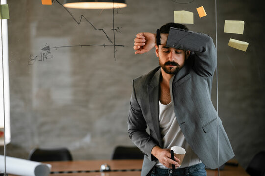 Businessman working on project. Young businessman working in the office.