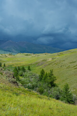 Fototapeta na wymiar Majestic mountain landscape, cloudy sky before a thunderstorm.