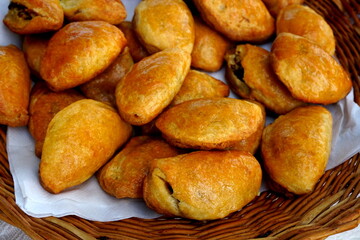 traditional home baked bacon and lard patty from a yeast dough. Home baked pies filled with smoked bacon. Traditional latvian kitchen recipe