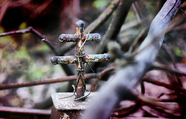 Grave crosses and tombstones stand in the old cemetery in Russia