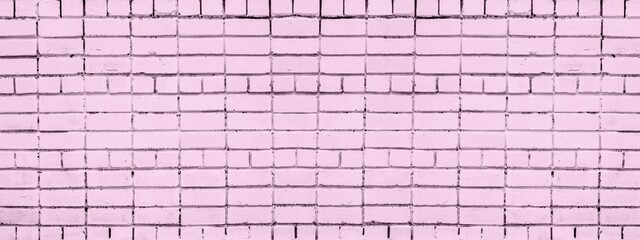 Fototapeta na wymiar Dusty pink color painted brick wall texture. Old shabby brickwork. Abstract grunge widescreen background