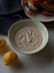 Tahini with roast vegetables on table