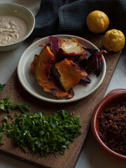 Rustic roast pumpkin slices on wooden board