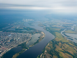 Fototapeta premium Aerial view of the Dnieper River and the city of Kiev from above. Summer sunny day.
