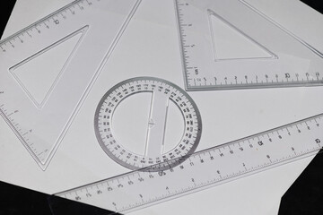 various rulers on white paper