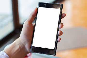 Young woman holding blank screen a smartphone for advertising text message, business concept.