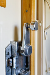 Naklejka premium Steel door Handle in a compartment car. High quality photo