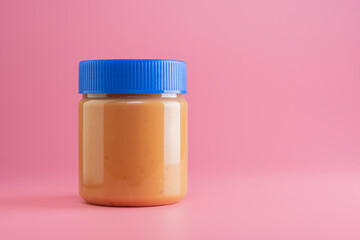 close up of peanut butter jar mockup isolated on pink background