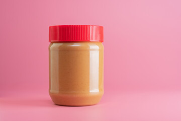 close up of peanut butter jar mockup isolated on pink background