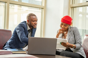 young black business man and woman in a meeting
