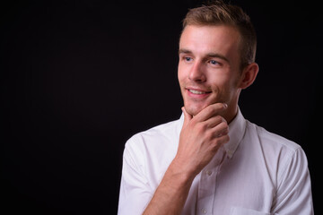 Portrait of young handsome businessman with blond hair