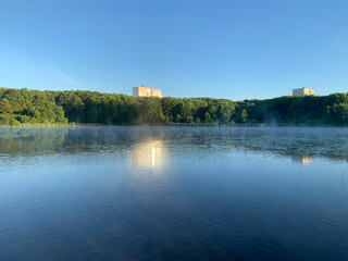 Fototapeta na wymiar Small fog over Pekhorka river in July morning. Balashikha, Moscow region, Russia